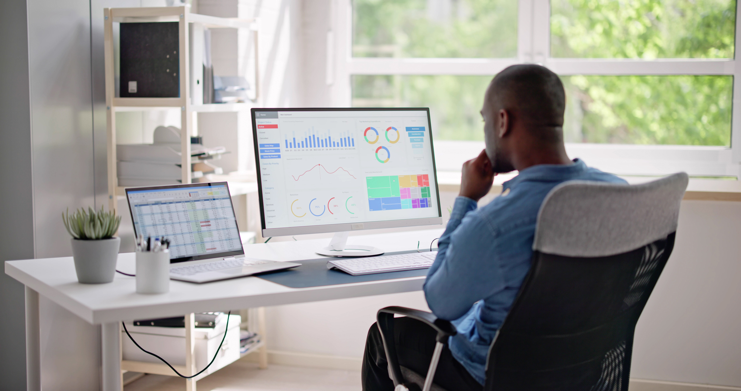 Businessman Using Analytics Data KPI Dashboard on Computer